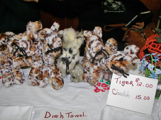 Tiger and cheetah stuffed animals.